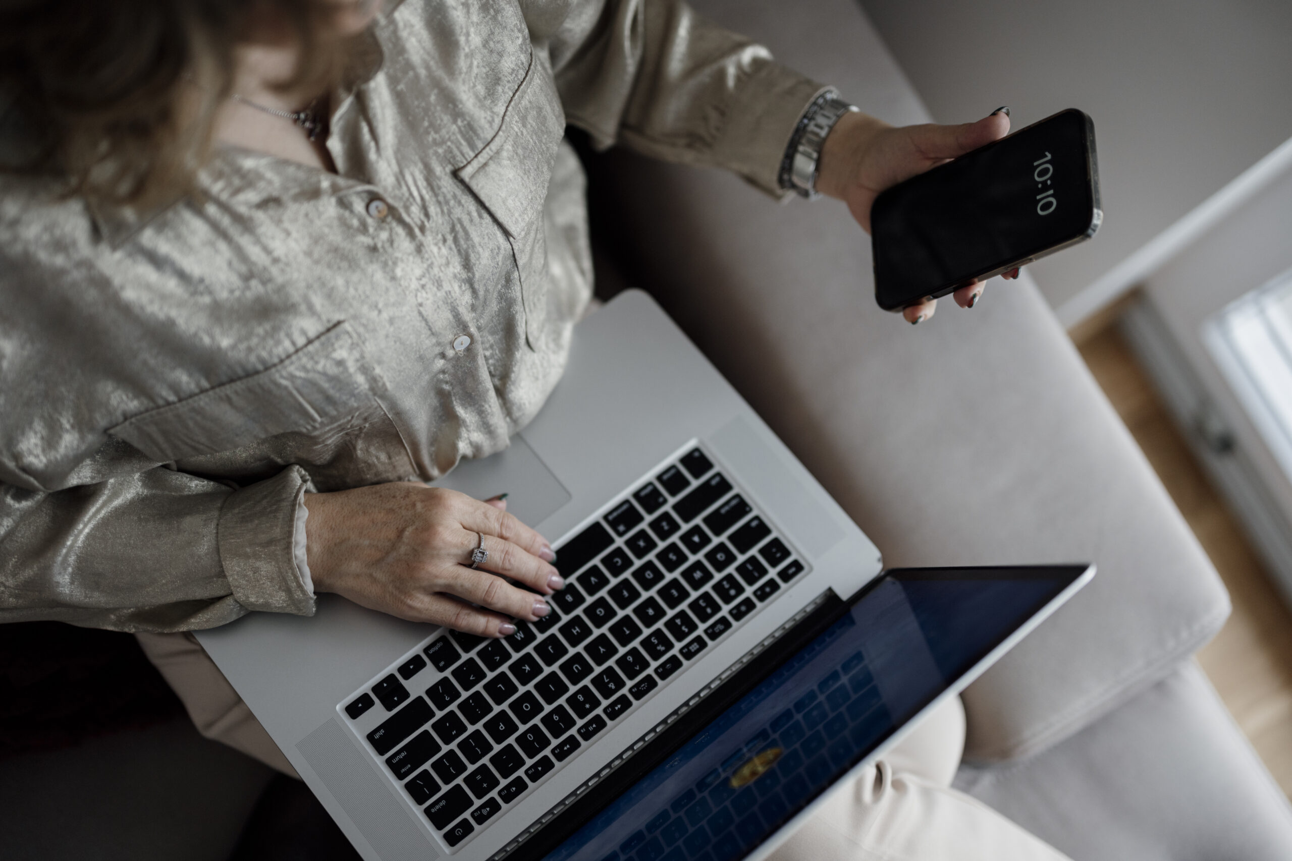 Person typing on a MacBook keyboard